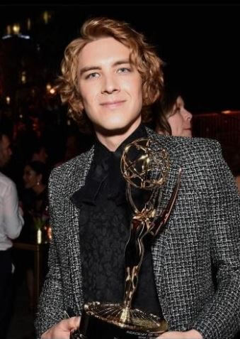 Eric Smith boyfriend Cody Fern with his award.